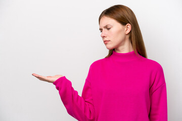 Young English woman isolated on white background holding copyspace with doubts