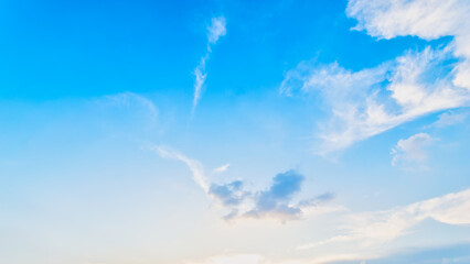 Wall Mural - Blue sky background with the sun,Blue sky with white clouds floating in the sky.