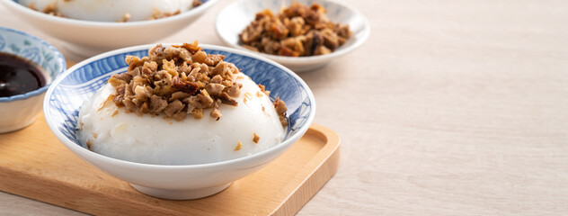 Wall Mural - Taiwanese savory rice pudding Wa gui with chopped dried radish and soy sauce