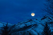 © Tetra Images - USA, Idaho, Bellevue, Full moon over snow covered hills at night