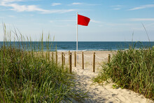 Red Flag Riptide Warning On The Beach