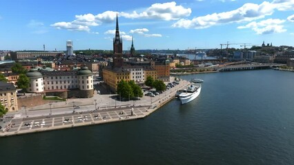 Wall Mural - Aerial view of the Stockholm old town - Gamla Stan cityscape near the City Hall top in Sweden. Beautiful summer time in Stockholm. Old town view.