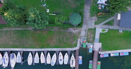 Poster - Aerial view of Boats moored to the shore, marina. Drone View of yachts on the lake. The concept of sailing yachts, boats on the lake, sea.