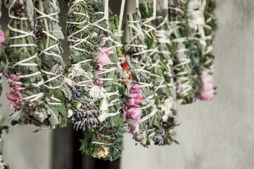 Wall Mural - Smudge sticks on the rope. Dried herbs bound in bundles and hung on the rope.