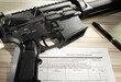 AR-15 and background check form for its purchase