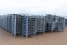 Sunbath Chairs On Upper Deck Of Cruise Liner.