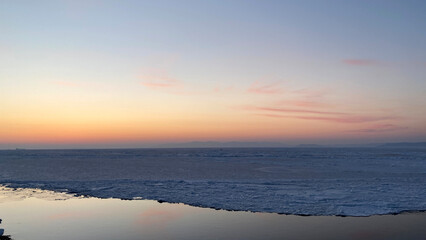 Canvas Print - Sunset over the frozen sea in winter