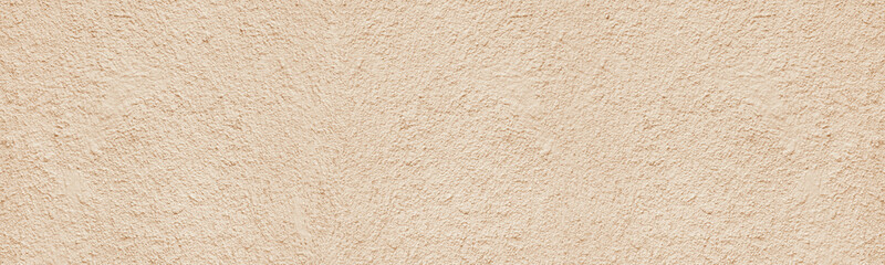 Old rough weathered plaster wide texture. Light golden beige painted textured cement aged cracked wall. Pastel color abstract panoramic grunge background