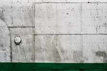 Metal Airplane Hull Plating With Rows Of Rivets