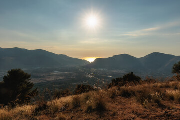 Wall Mural - Sunset in the Hills of Sicily on the coast in Summer near Palermo in Italy, Europe on a lovely warm evening