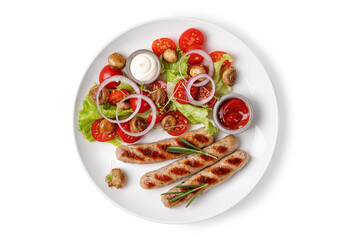 Grilled sausages with rosemary and salad with tomatoes on a plate isolated on white background. Dinner diet idea.