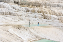 Pamukkale, Turkey, White Limestone  Terraces (travertine) And  Health-giving Thermal Pools. Unidentified People In The Pool.