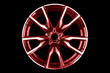 Red car alloy wheel isolated on black background. New alloy wheel for a car on a black background. Alloy rim isolated. Car wheel disc.