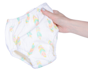 Children's training panties in hand on a white background isolation