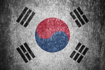 Wall Mural - Closeup of grunge South Korean flag. Dirty South Korea flag on a metal surface