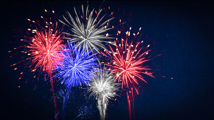 Wall Mural - USA america united states new year or Independence Day celebration holiday background greeting card - Blue red white firework on dark night sky.