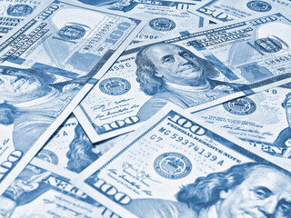Wall Mural - american paper money. 100 dollar and other us banknotes. light blue tinted background or backdrop. s