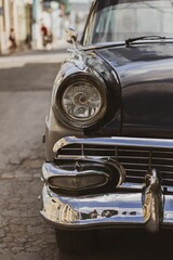 Sticker - Vertical shot of a front part of a beautiful black retro car