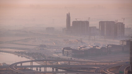 Wall Mural - Bussy traffic on the overpass intersection in Dubai downtown aerial timelapse.