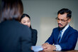 © Wutthichai - Businessman having a meeting with executives