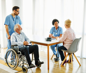 Wall Mural - nurse doctor senior care caregiver help assistence wheelchair retirement home nursing elderly woman disabled disability man walker