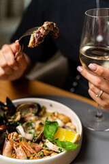 Wall Mural - Whole fried octopus on the stone cutting board. Whole bowl of mussels and langoustines. Seafood menu. Seafood festival. Rustic style fork.