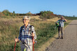 © pucko_ns - Active old woman and man walking at field and enjoy