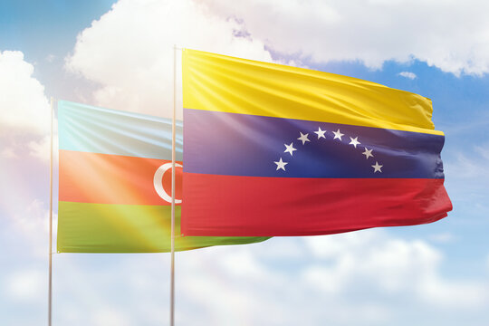 Sunny blue sky and flags of venezuela and azerbaijan