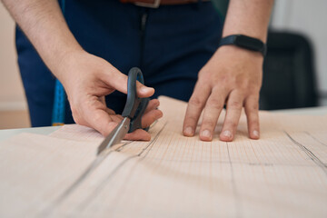 Wall Mural - Fashion designer cutting sketches of new clothes