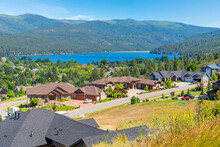Summer View Of The Blue Water Of Liberty Lake Seen From A Hillside Luxury Subdivision Of Homes In Liberty Lake, Washington, A Suburb Of Spokane.