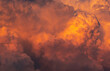 Leinwandbild Motiv Dramatic orange sky and clouds abstract background. Top view of orange clouds. Warm weather background. Art picture of orange clouds texture.