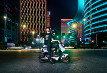 Couples Travel In Electric Bicycle At Night