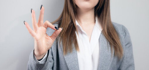 business woman showing ok sign