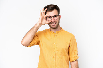 Young caucasian man isolated on white background showing ok sign with fingers