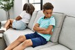 © Krakenimages.com - Brother and sister angry having problem sitting on sofa at home
