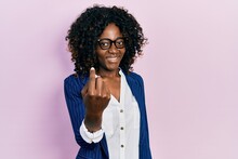 Young African American Woman Wearing Business Clothes And Glasses Beckoning Come Here Gesture With Hand Inviting Welcoming Happy And Smiling