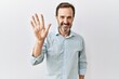 © Krakenimages.com - Middle age hispanic man with beard standing over isolated background showing and pointing up with fingers number five while smiling confident and happy.
