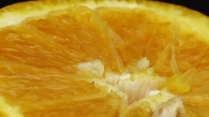 Wall Mural - 4K Macro shot of navel orange fruit and rotate.Close up fresh citrus orange  background 4K UHD video