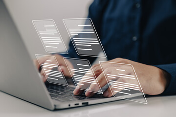 Leinwandbilder - A businessman working on a laptop computer with electronic document icons, E-document management, an online documentation database, and the concept of a paperless office.