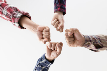 Wall Mural - young business people putting their hands together