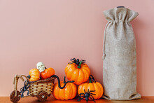 Halloween Mockup With Wine Bag Blank With Pupkin And Spiders.