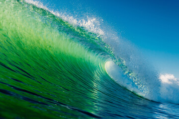 Wall Mural - Ideal barrel wave with green tones in ocean. Swell waves for surfing