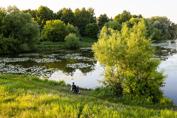 Canvas Print - overgrown Kolomenka river in Kolomna at sunset