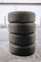 Four Summer Rubber Tires From The Wheel Are In The Tire Shop For Replacement.