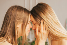 Two Women Touch Each Other's Foreheads. Women's Health, Relaxation, Rest, Mental Health Harmony