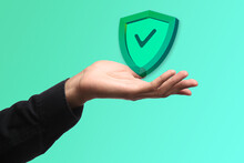 Male Hand And Icon Of Antivirus On Green Background