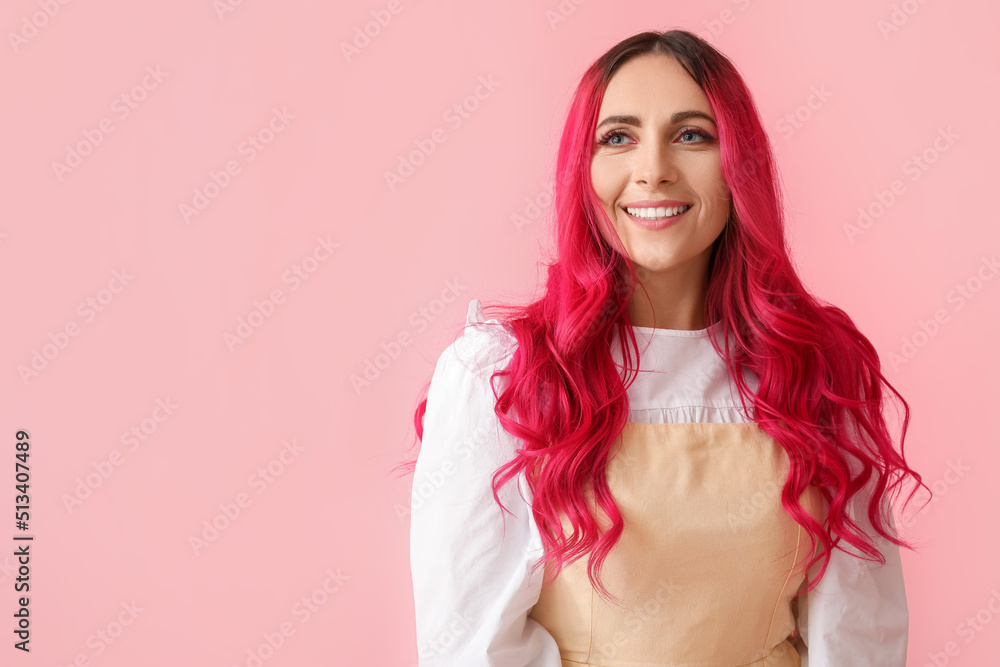 Beautiful woman with bright hair on pink background
