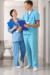 Wall Mural - Medical assistants with clipboards in clinic