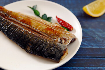 Wall Mural - Grilled fish dish mackerel on the table