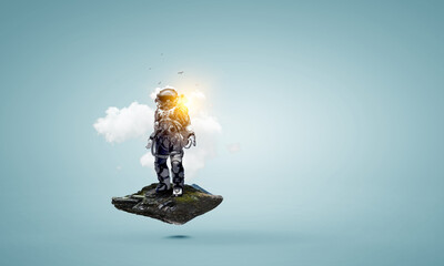 Wall Mural - spaceman on a light bulb